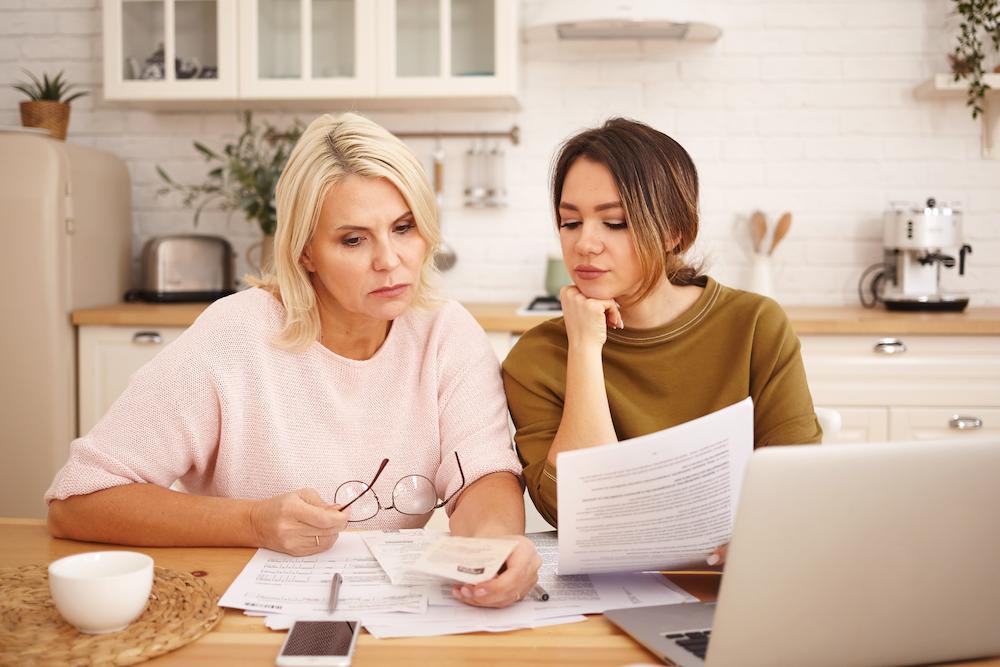 Canadian family reviewing household bills together